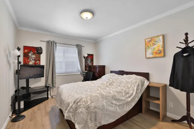 a bed room with a bed and a desk