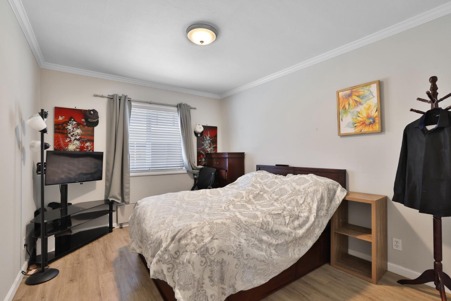 1431 Dwight Way Berkeley, CA 94702 - Photo 16 of 21 a bed room with a bed and a desk