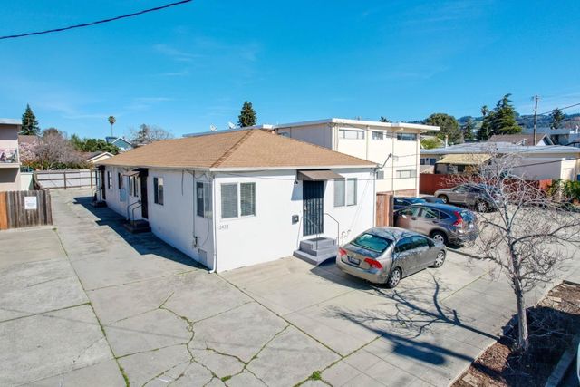 a white house with a table and chairs