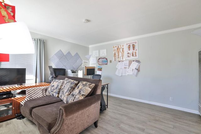 a bedroom with a bed and a fireplace