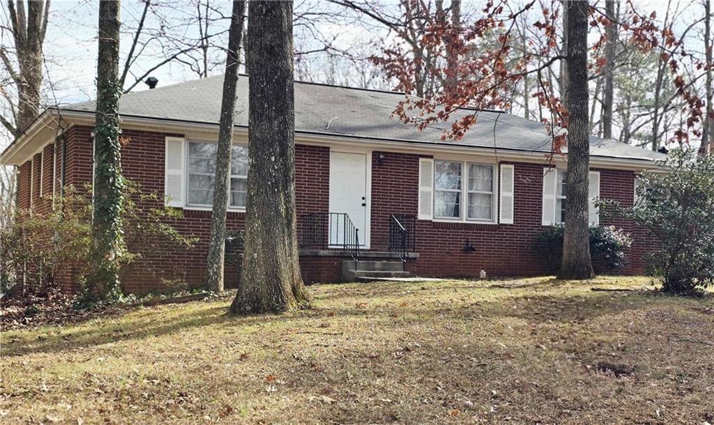 601 Walnut Place Marietta, GA 30060 - Photo 1 of 1 a view of a house with a yard and large tree