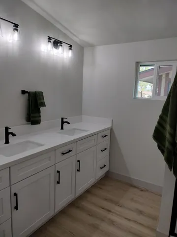 a bathroom with a glass shower door