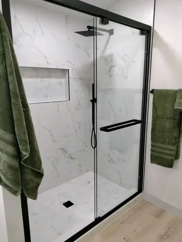 a white toilet sitting next to a white sink