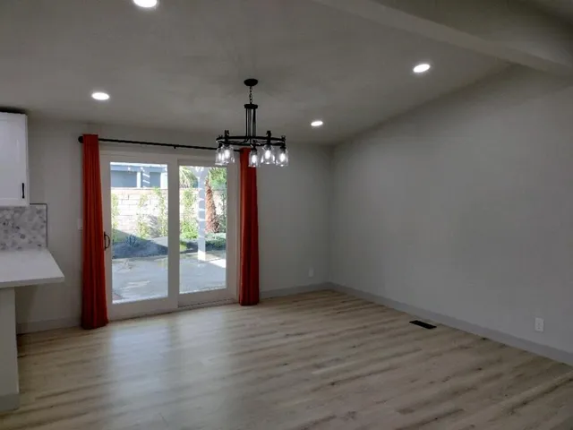 a kitchen with kitchen island a sink stainless steel appliances and cabinets