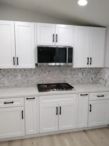 a close up of a stove top oven sitting on a floor
