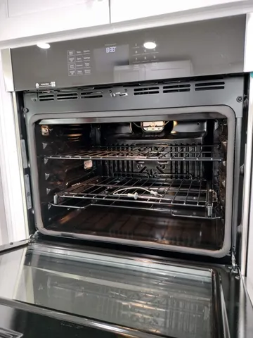 a patio with water fountain and outdoor seating