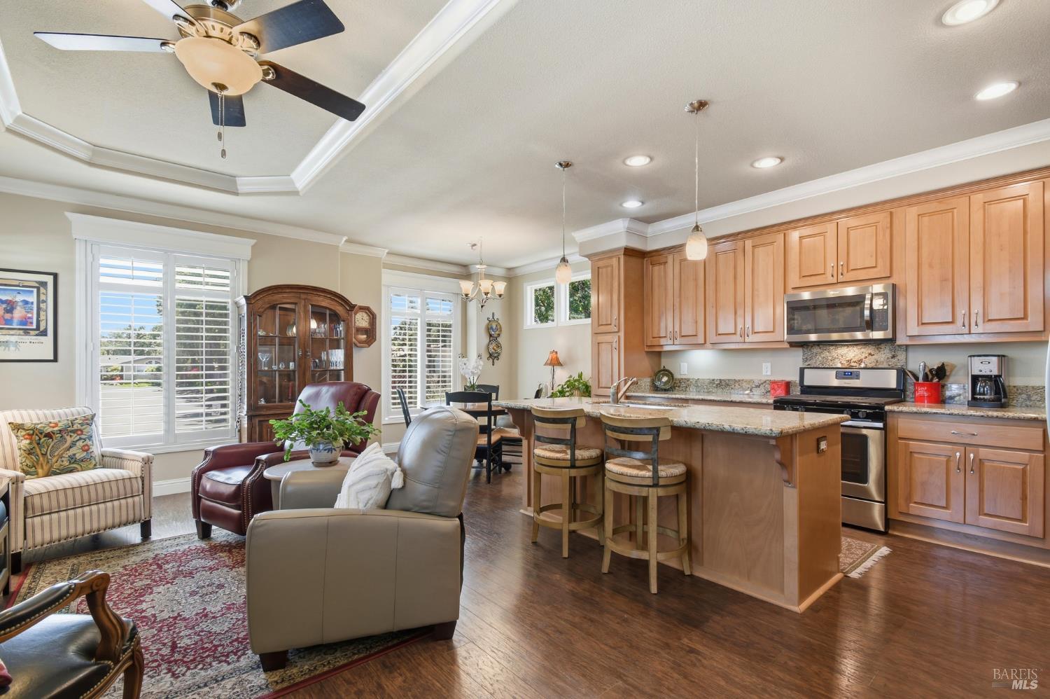 120 Shamrock Circle Santa Rosa, CA 95403 - Photo 3 of 45 a living room with stainless steel appliances kitchen island granite countertop furniture and a wooden floor