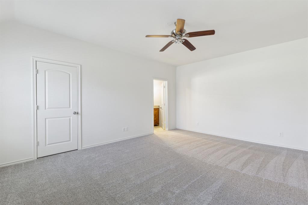 233 Firefly Drive Springtown, TX 76082 - Photo 11 of 16 Primary bedroom with closet and bathroom