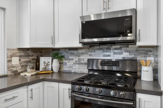 a living room with furniture and a rug