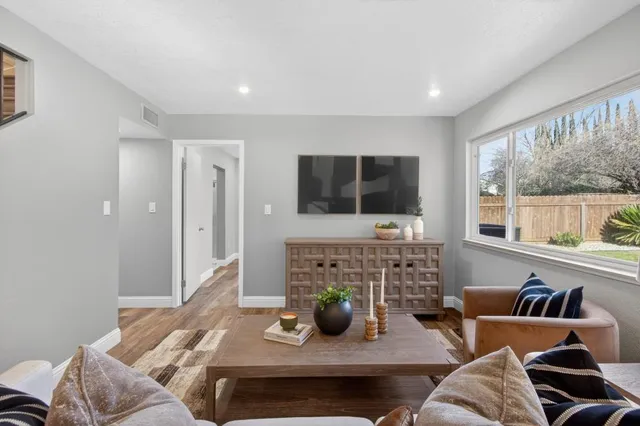 a living room with furniture and a window