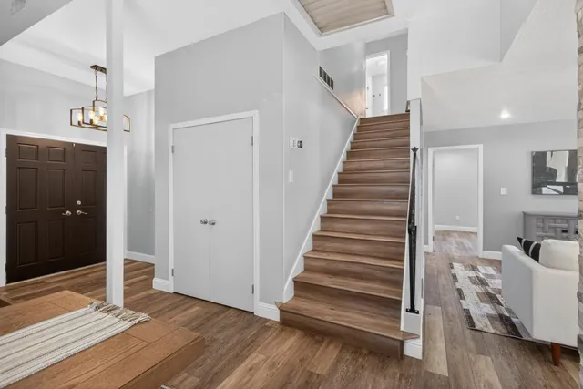 a view of a room with a ceiling fan