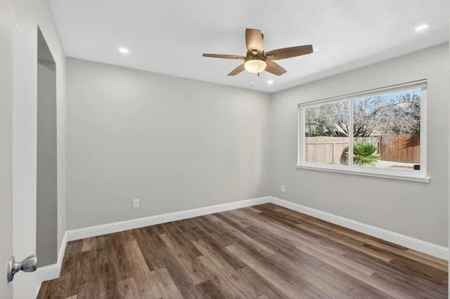 a bathroom with a tub shower and a sink