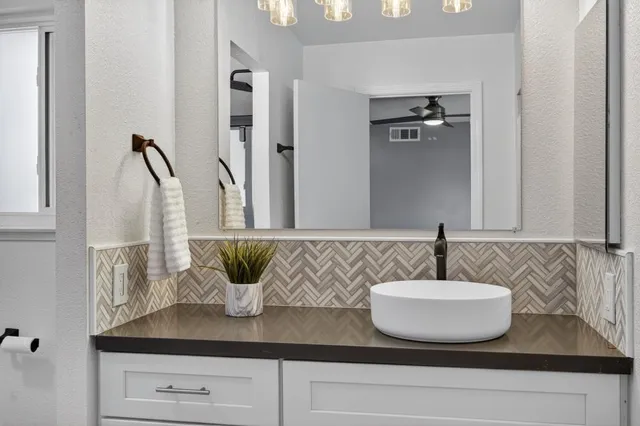 a view of a backyard with swimming pool