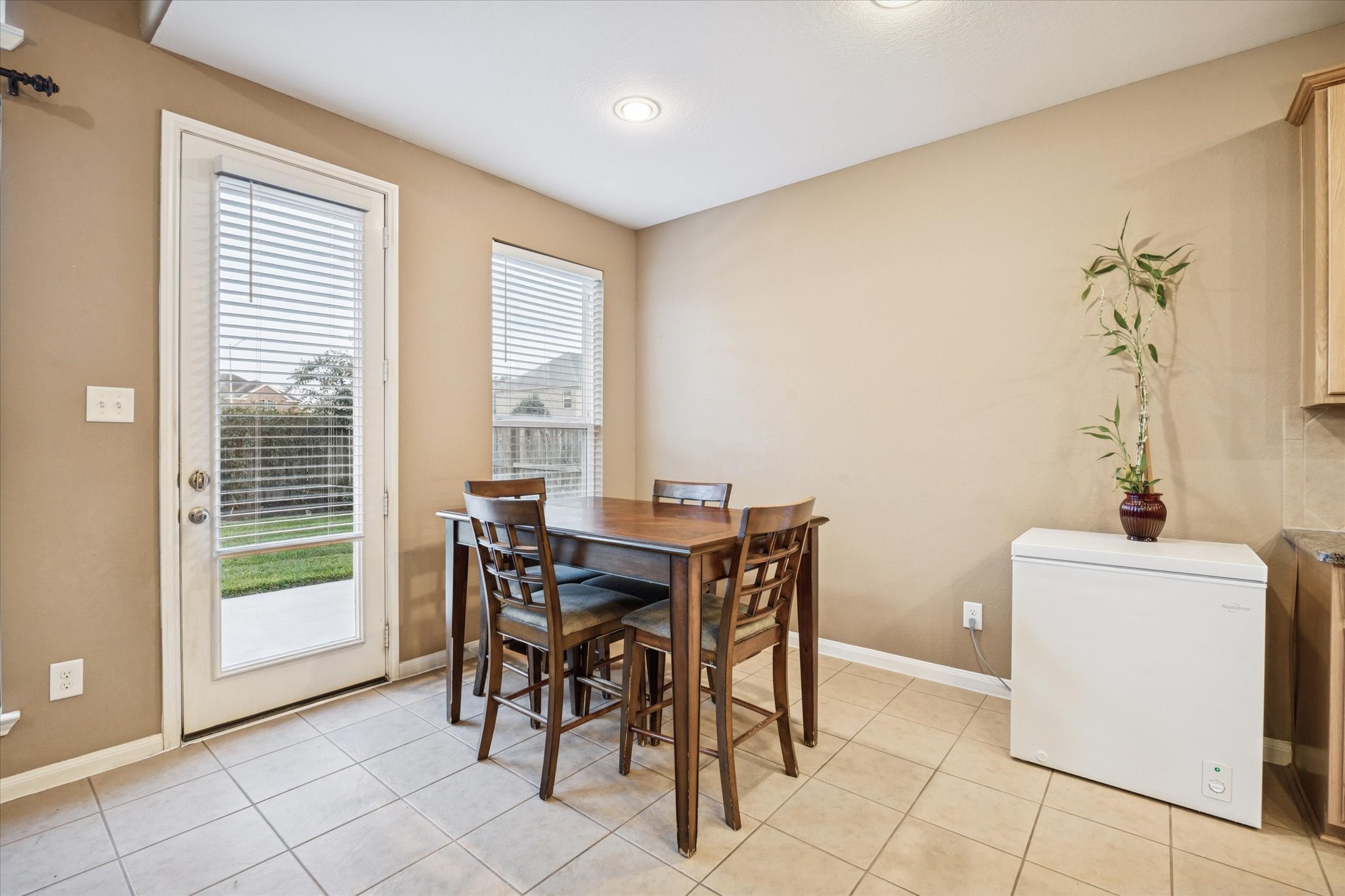 7023 Sliding Rock Circle Spring, TX 77379 - Photo 11 of 39 a view of a dining room with furniture and a window