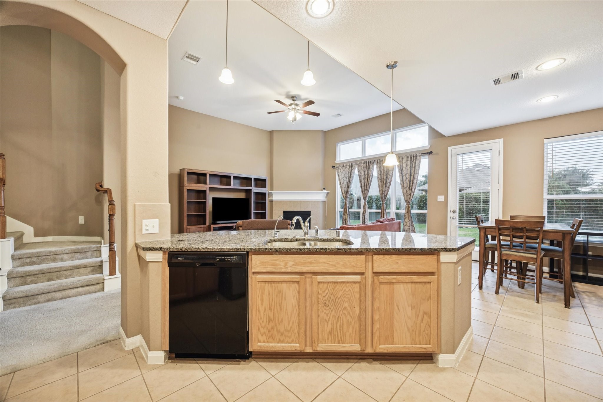 7023 Sliding Rock Circle Spring, TX 77379 - Photo 14 of 39 a kitchen with cabinets and chairs