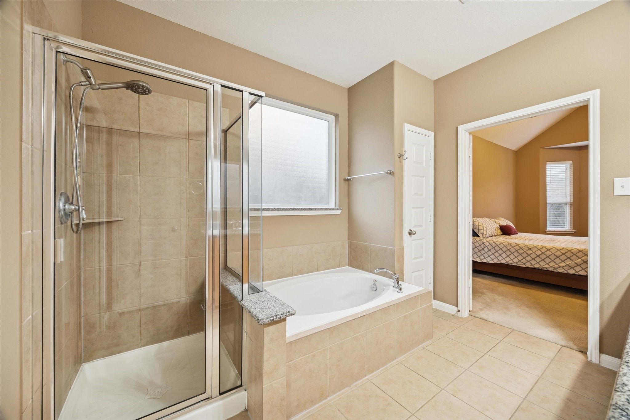 7023 Sliding Rock Circle Spring, TX 77379 - Photo 19 of 39 a bathroom with a tub and shower