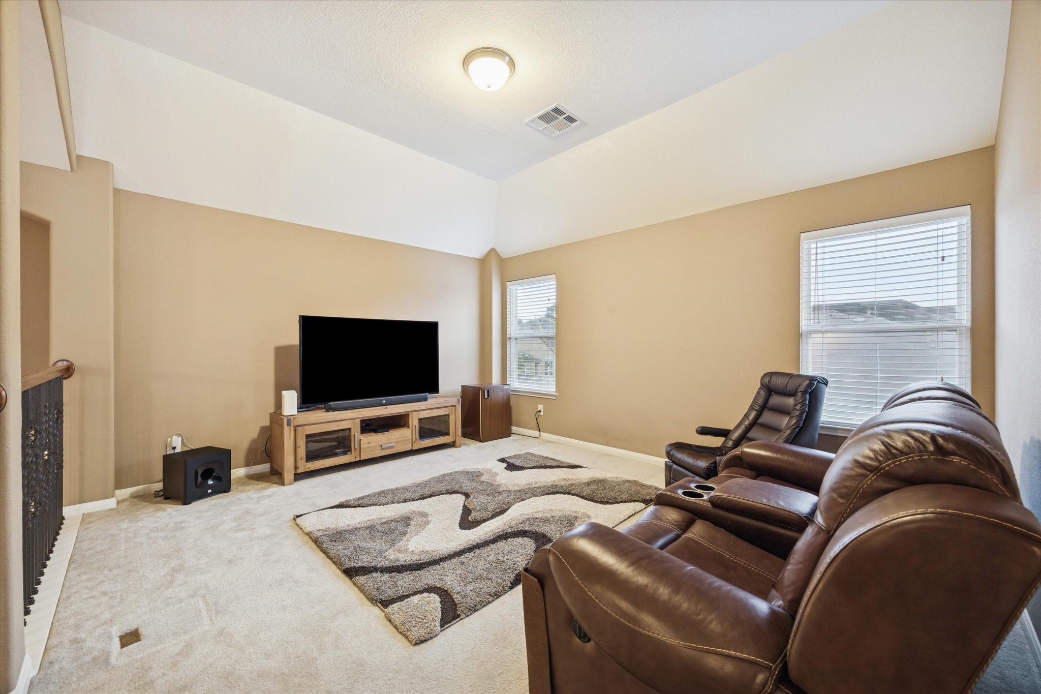 7023 Sliding Rock Circle Spring, TX 77379 - Photo 20 of 39 a living room with furniture and a flat screen tv