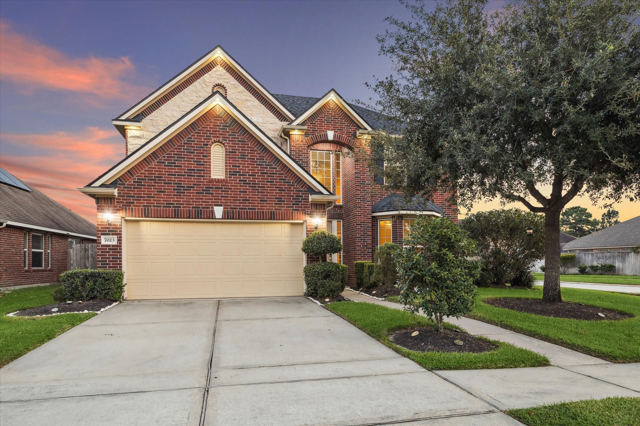 7023 Sliding Rock Circle Spring, TX 77379 - Photo 2 of 39 a front view of a house with a yard and trees