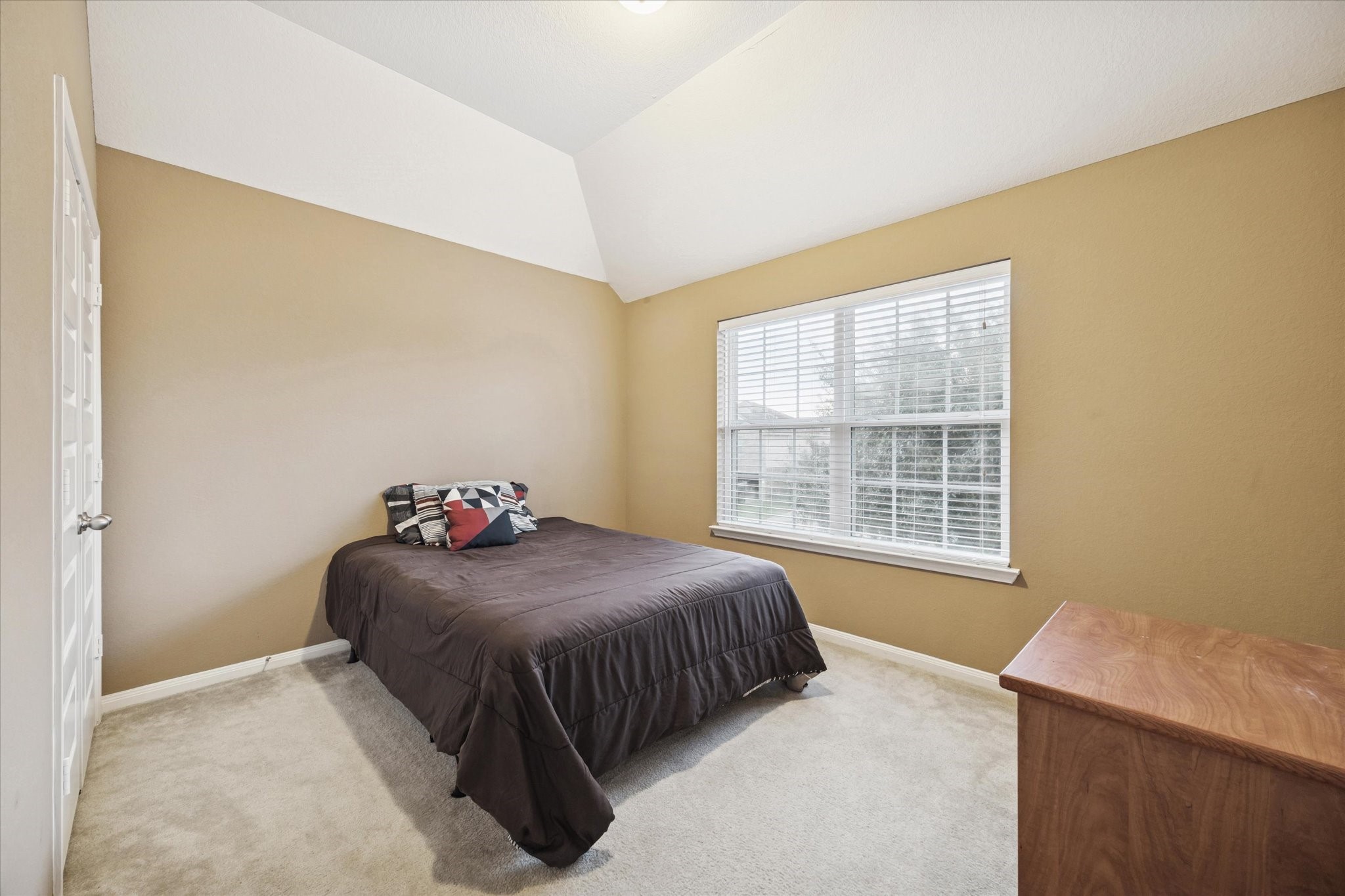 7023 Sliding Rock Circle Spring, TX 77379 - Photo 22 of 39 a bedroom with a bed and a window