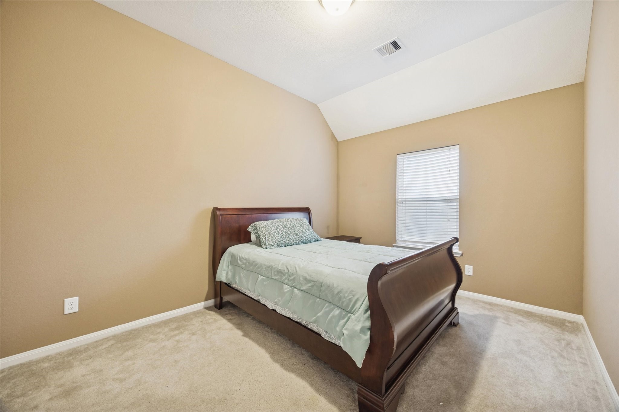 7023 Sliding Rock Circle Spring, TX 77379 - Photo 23 of 39 a bedroom with a bed and a window