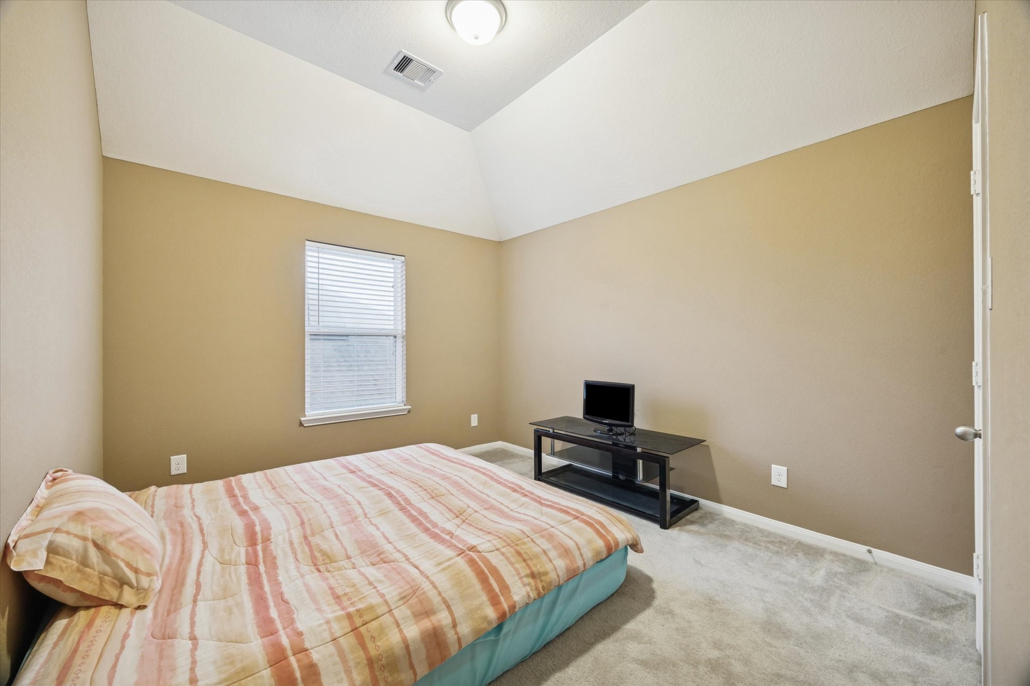 7023 Sliding Rock Circle Spring, TX 77379 - Photo 24 of 39 a bedroom with a bed and a window