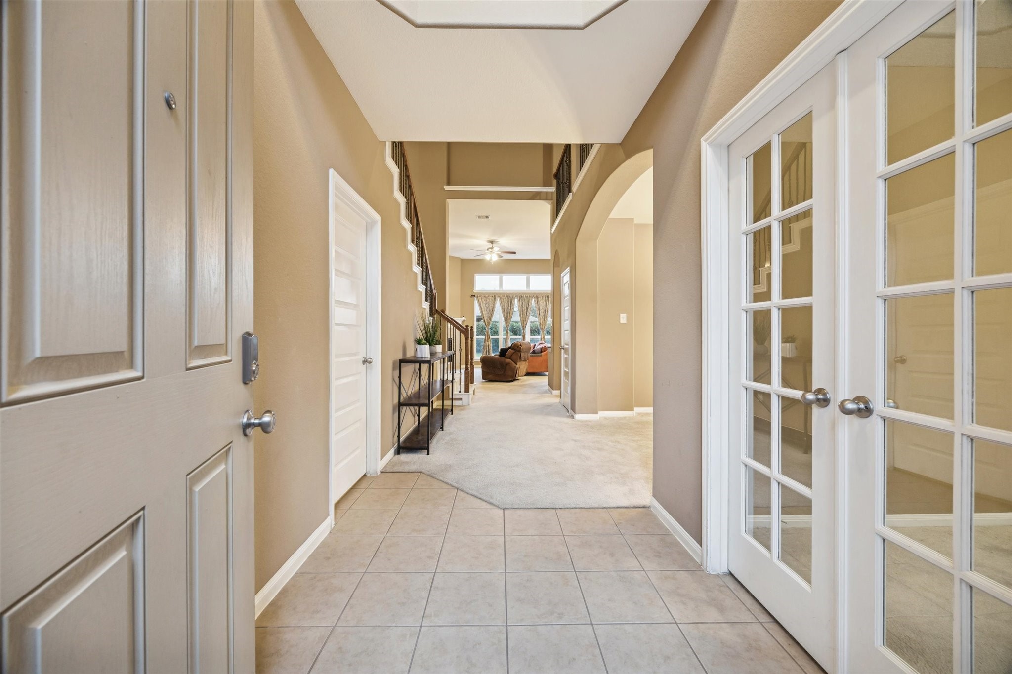 7023 Sliding Rock Circle Spring, TX 77379 - Photo 3 of 39 a hallway with wooden floor and staircase