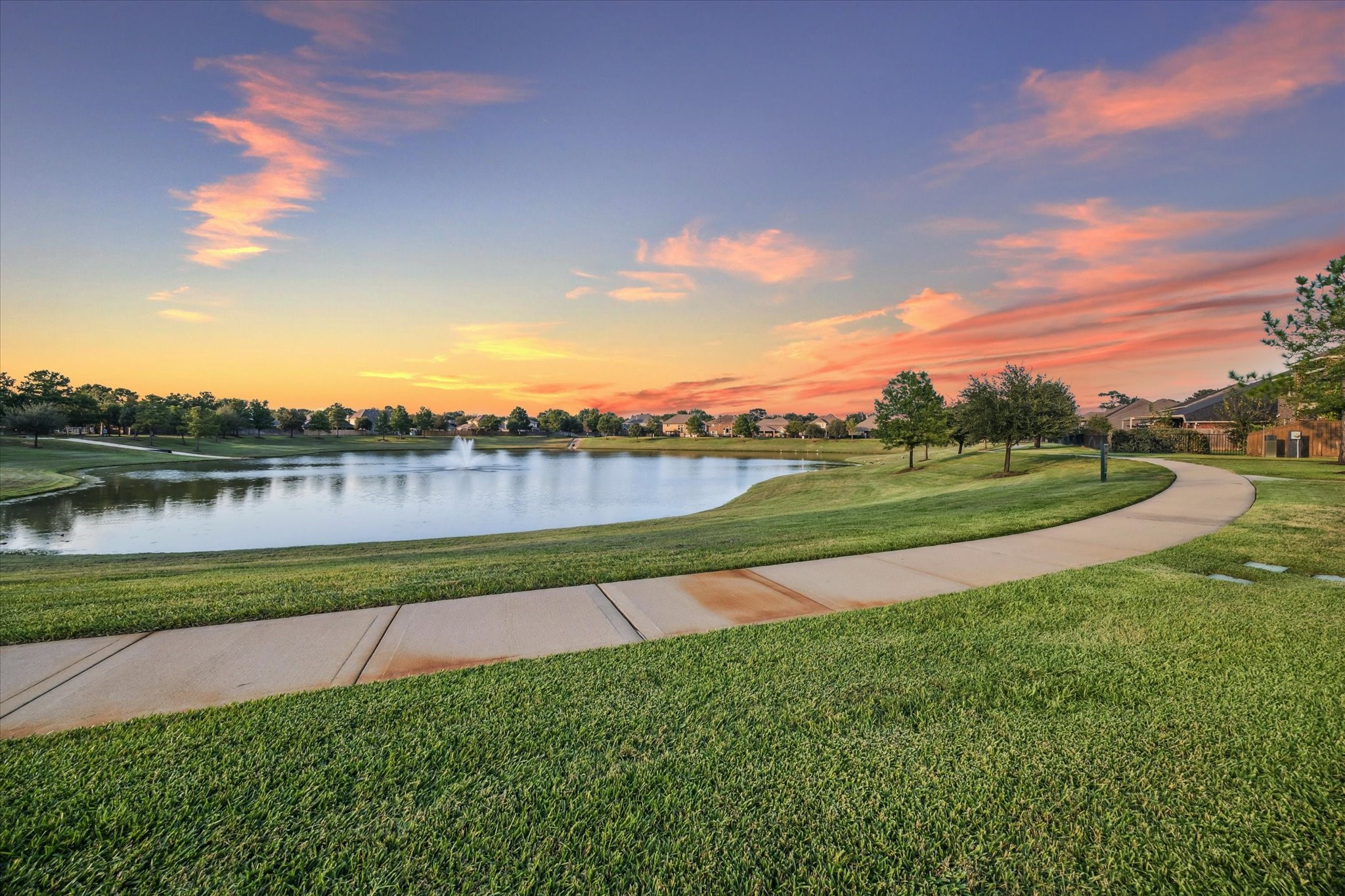 7023 Sliding Rock Circle Spring, TX 77379 - Photo 37 of 39 a view of a lake with houses in the back