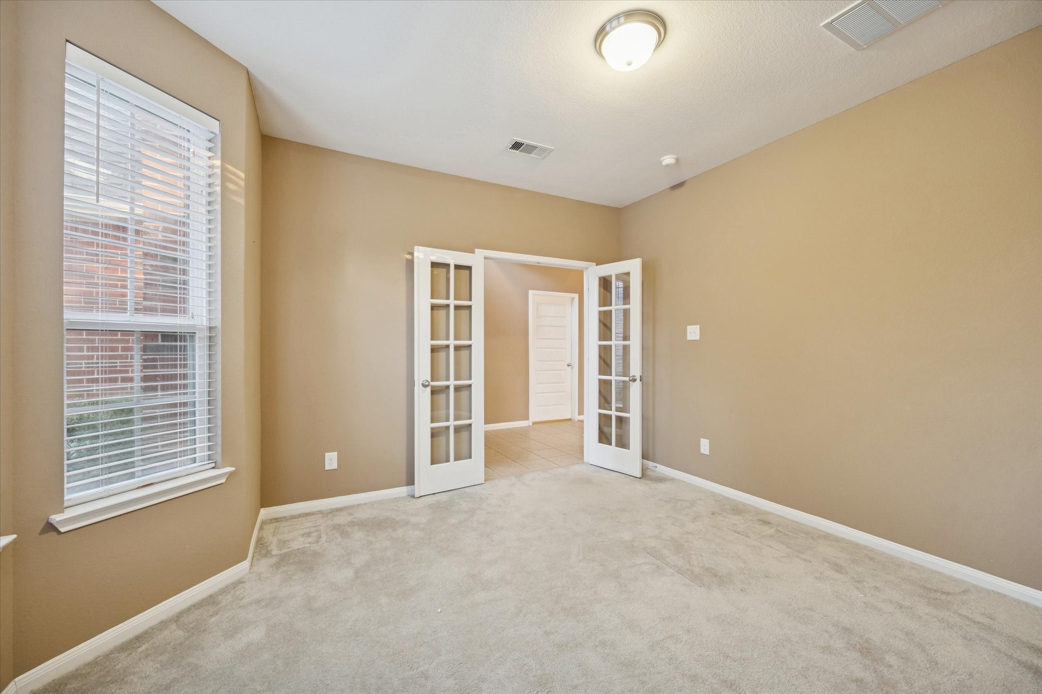 7023 Sliding Rock Circle Spring, TX 77379 - Photo 5 of 39 a view of an empty room with a window
