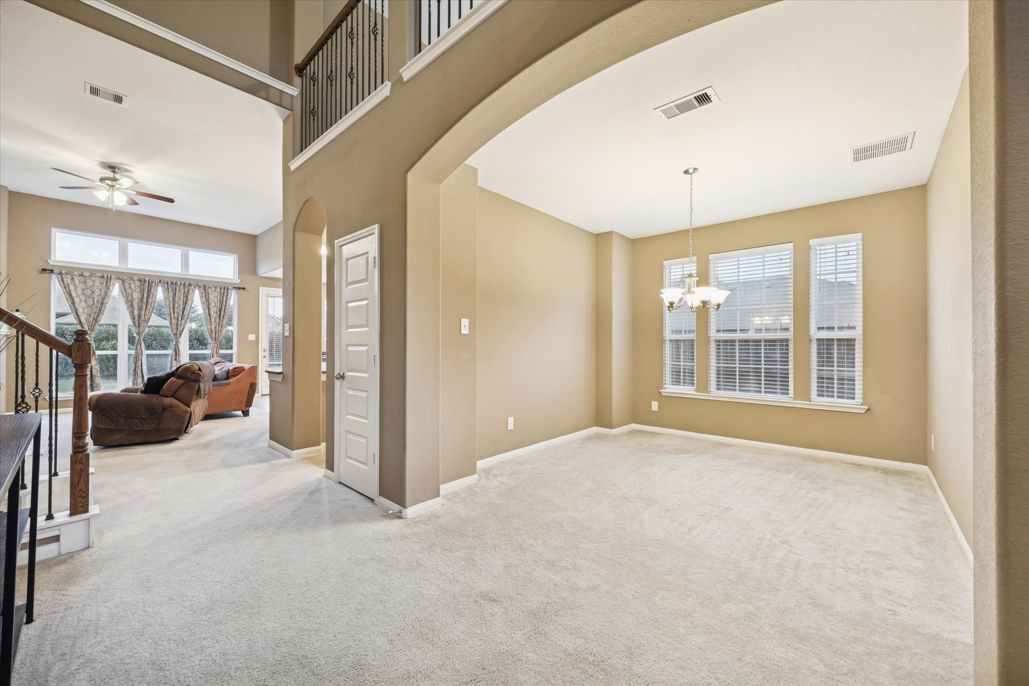 7023 Sliding Rock Circle Spring, TX 77379 - Photo 6 of 39 a view of a big room with windows and entryway
