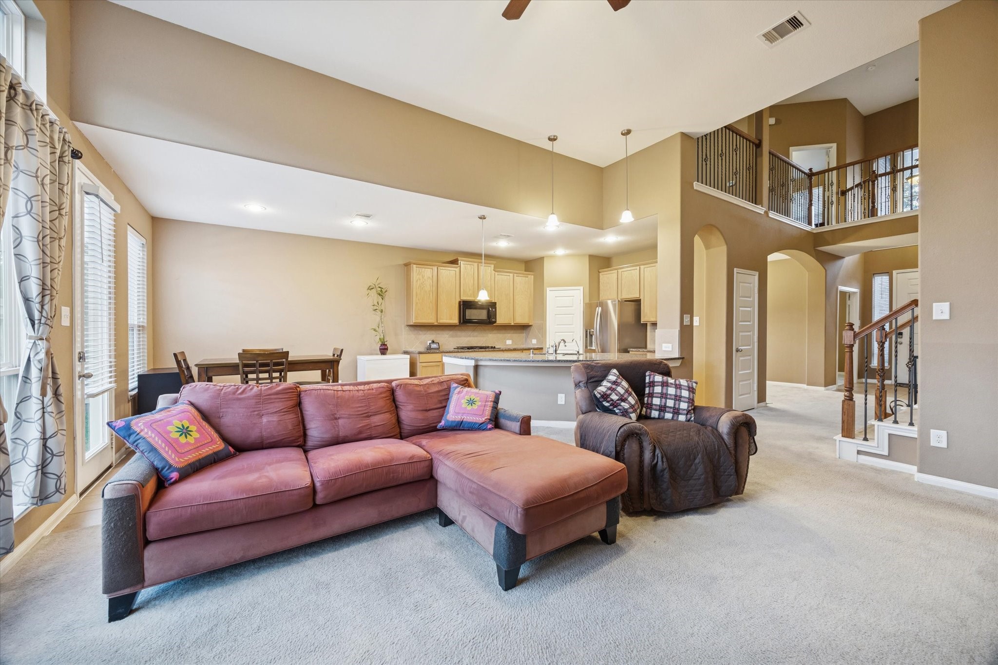 7023 Sliding Rock Circle Spring, TX 77379 - Photo 10 of 39 a living room with furniture kitchen view and a large window