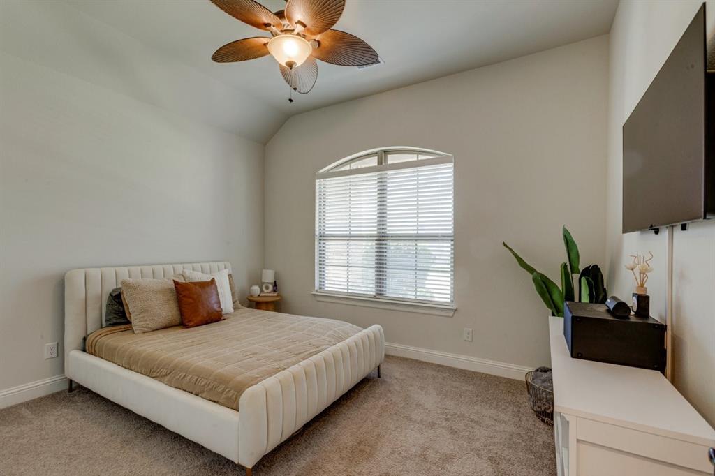 9613 Boulder Pt Road Oak Point, TX 75068 - Photo 24 of 28 Vaulted ceiling bedroom with a ceiling fan