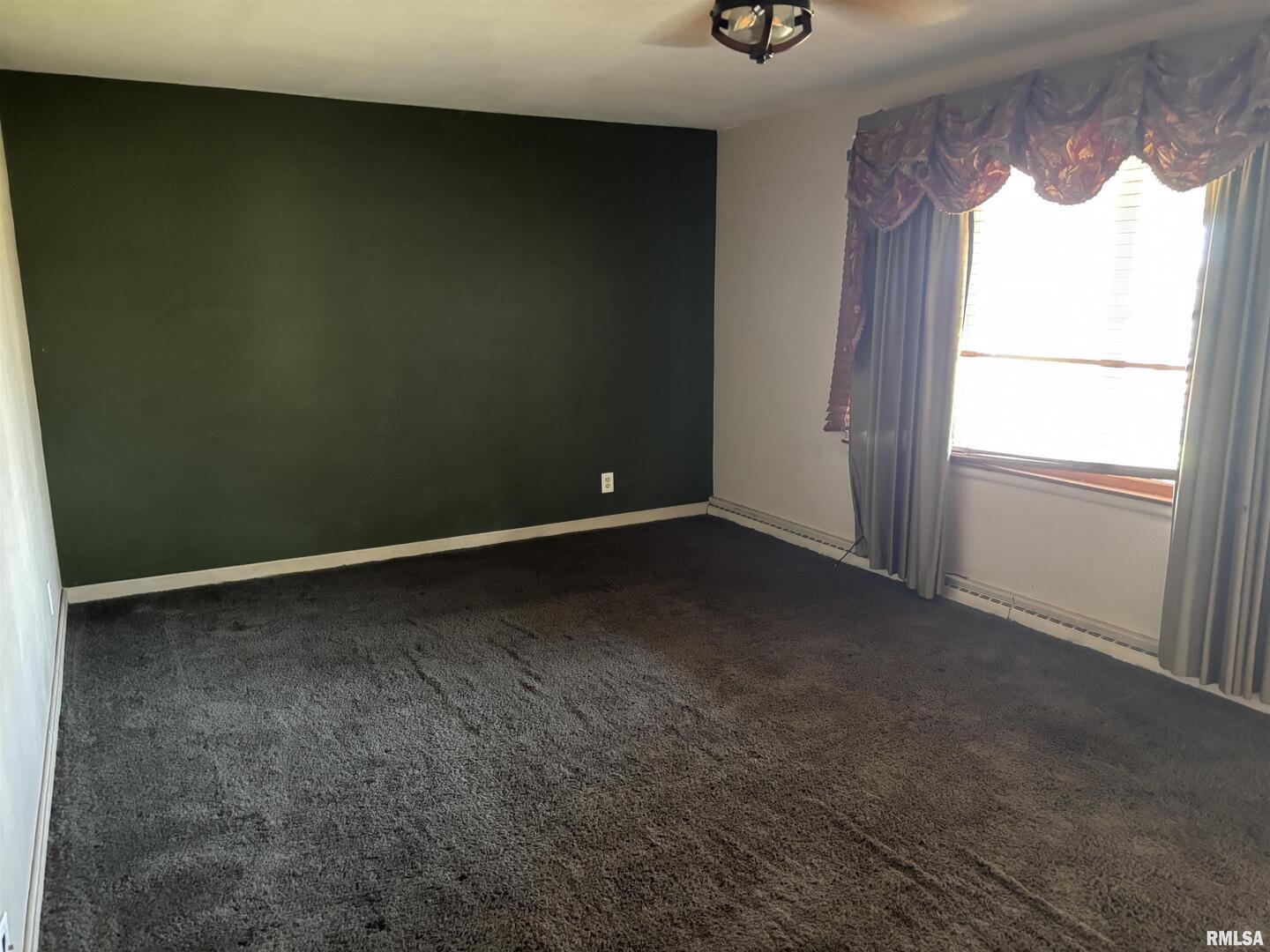 3638-84 84th Thomson, IL 61285 - Photo 11 of 43 a view of an empty room with a window