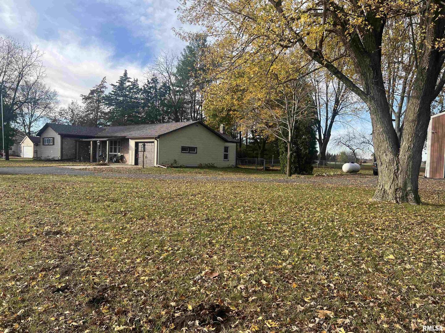 3638-84 84th Thomson, IL 61285 - Photo 2 of 43 a house with trees in front of it