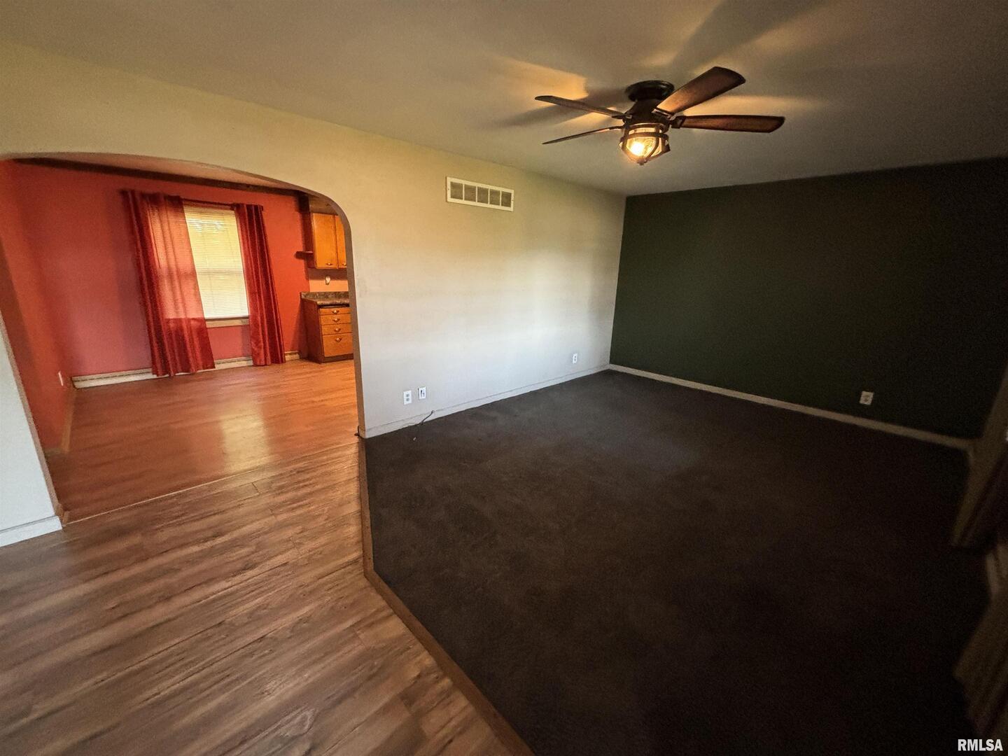 3638-84 84th Thomson, IL 61285 - Photo 26 of 43 a view of an empty room with window and a ceiling fan
