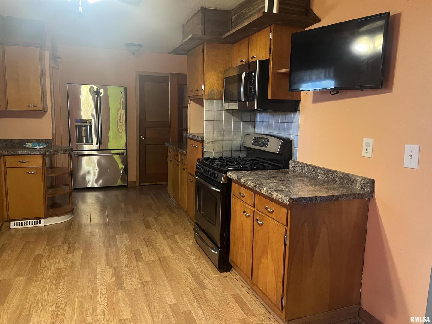 3638-84 84th Thomson, IL 61285 - Photo 3 of 43 a kitchen with a sink and steel appliances