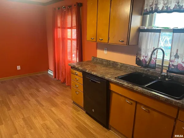 a kitchen with a sink and cabinets