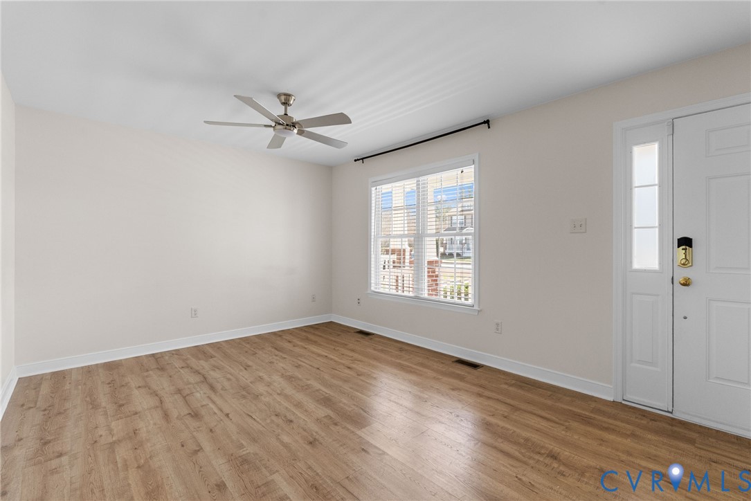2110 Chaucer Court Aylett, VA 23009 - Photo 12 of 40 wooden floor in an empty room with a window