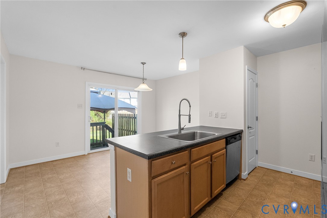 2110 Chaucer Court Aylett, VA 23009 - Photo 14 of 40 a kitchen with a sink a counter space and a window