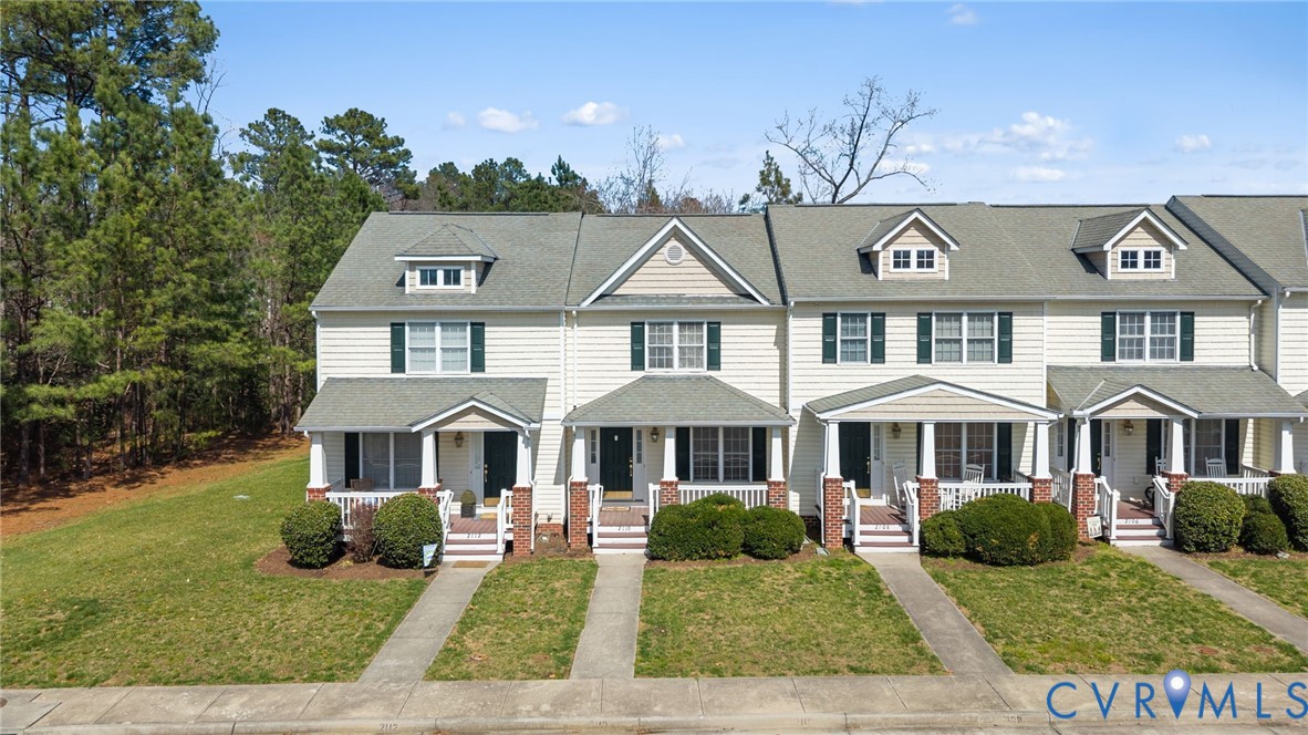 2110 Chaucer Court Aylett, VA 23009 - Photo 2 of 40 a front view of a house with a yard