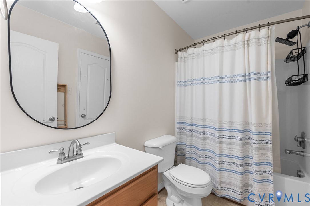 2110 Chaucer Court Aylett, VA 23009 - Photo 28 of 40 a bathroom with a sink toilet and shower