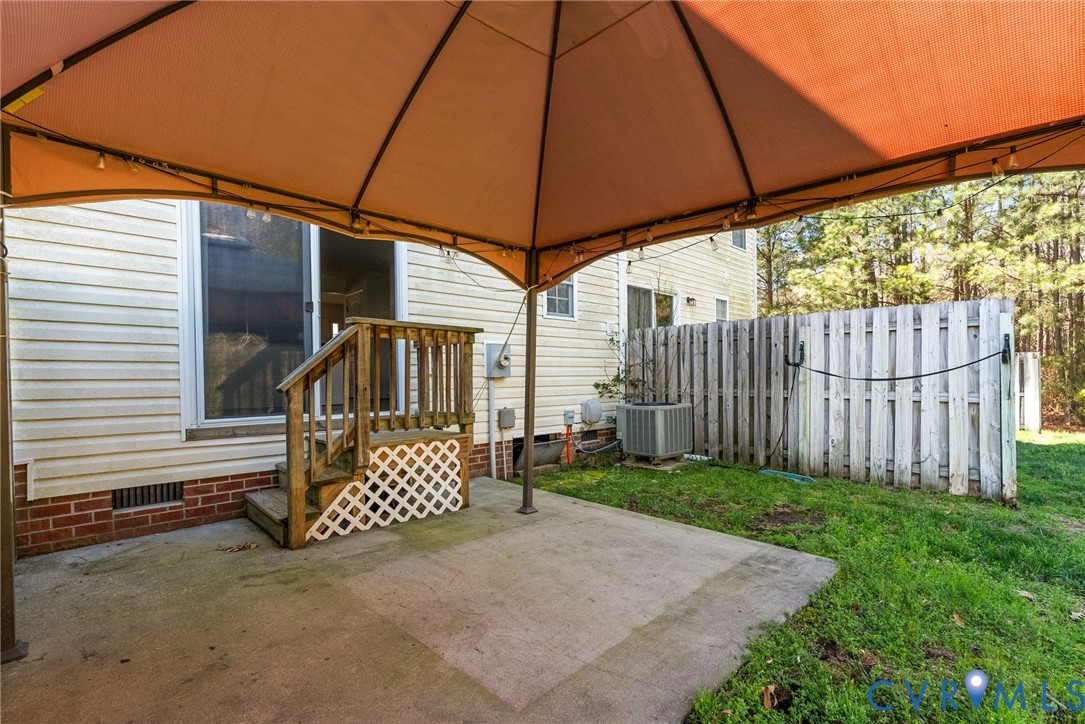 2110 Chaucer Court Aylett, VA 23009 - Photo 35 of 40 a view of a house with backyard and sitting area