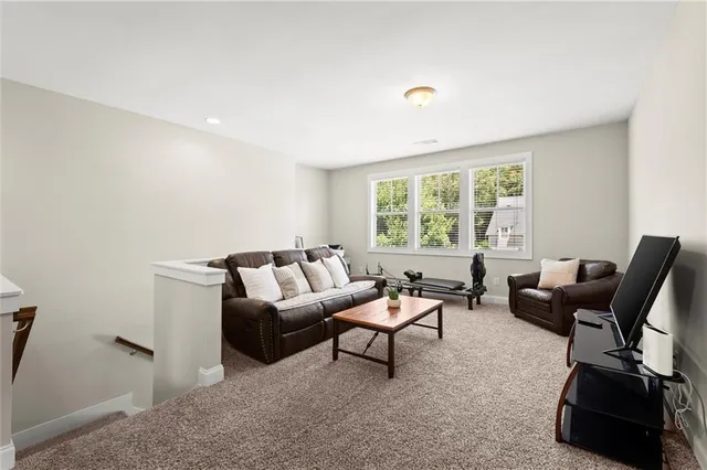 a view of livingroom with workspace and a window