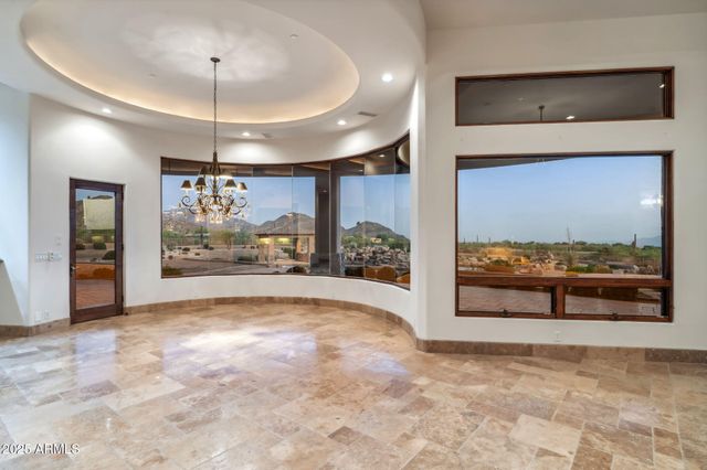 a spacious bathroom with a granite countertop sink a mirror and a shower