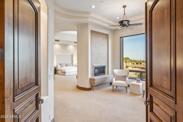a large kitchen with a sink and cabinets