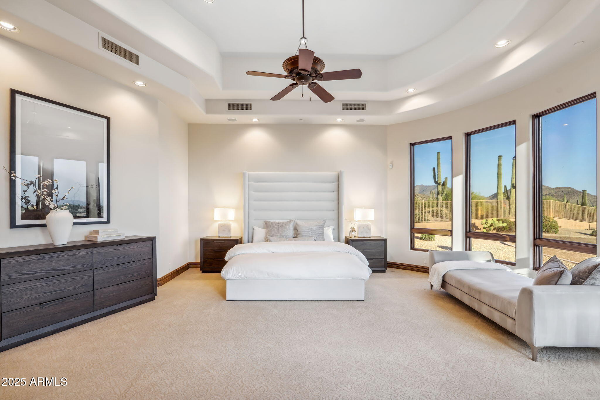 9701 East Happy Valley Road, Unit 28 Scottsdale, AZ 85255 - Photo 39 of 83 a spacious bedroom with a large bed and a couch