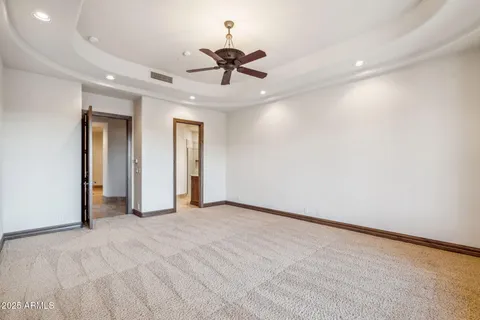 a view of a swimming pool and couches in the patio