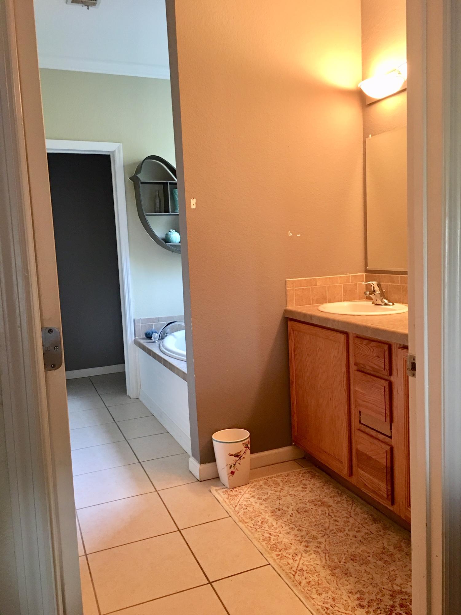 47 Central 7th Street Santa Rosa Beach, FL 32459 - Photo 8 of 19 a bathroom with a sink a toilet and mirror