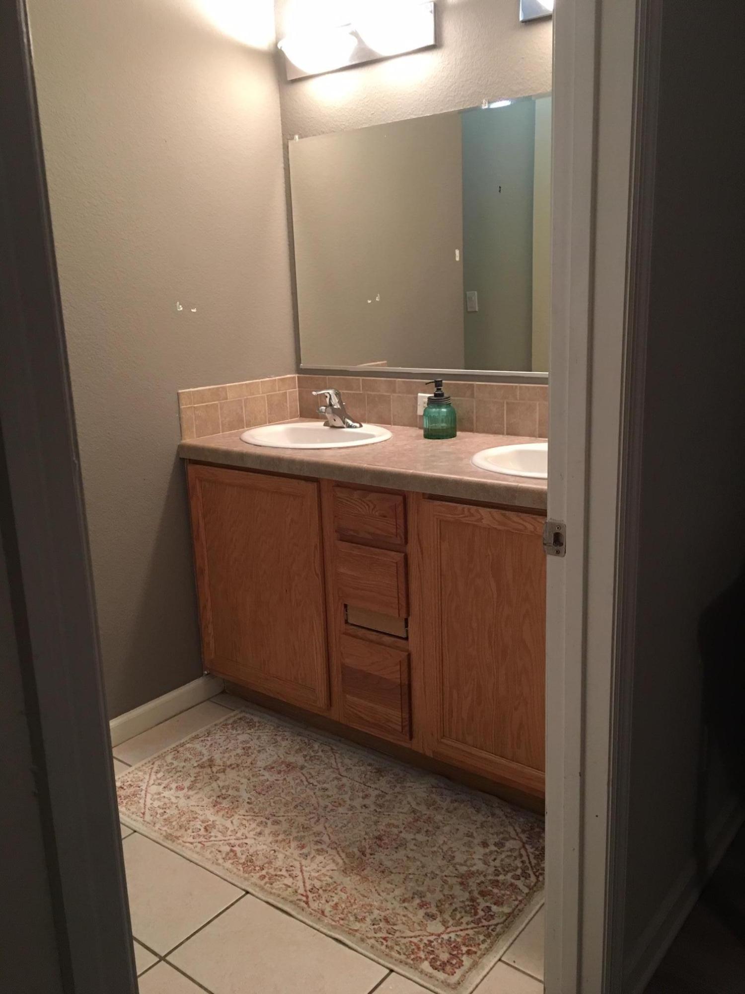 47 Central 7th Street Santa Rosa Beach, FL 32459 - Photo 9 of 19 a bathroom with a sink vanity and mirror