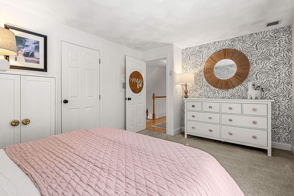 19 Powhatan Road Pepperell, MA 01463 - Photo 24 of 38 a bedroom with a bed and a cabinets