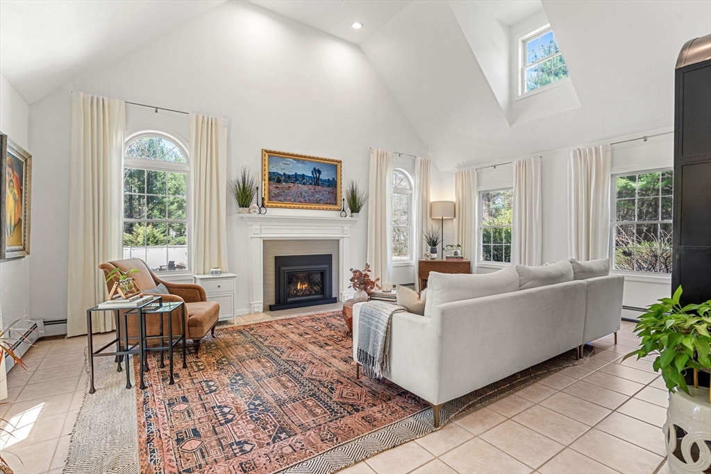 19 Powhatan Road Pepperell, MA 01463 - Photo 3 of 38 a living room with furniture and a fireplace